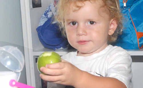 Koby Lindsell about to enjoy a healthy serve of fruit at the Happy Days Child Care Centre. Koby Lindsell about to enjoy a healthy serve of fruit at the Happy Days Child Care Centre.